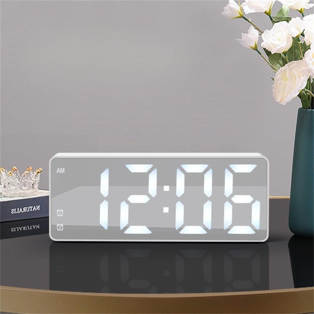 Modern LED digital alarm clock with large white display on a bedside table, minimalist home décor and practical gift idea