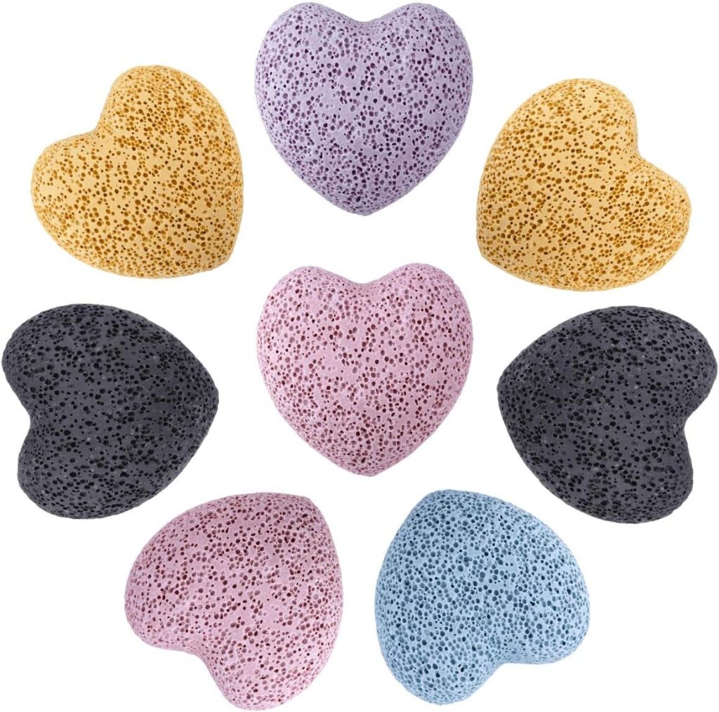 Heart-shaped natural pumice stones in soft pastel tones, a thoughtfully curated Airawath self-care essential designed for gentle exfoliation and mindful daily rituals