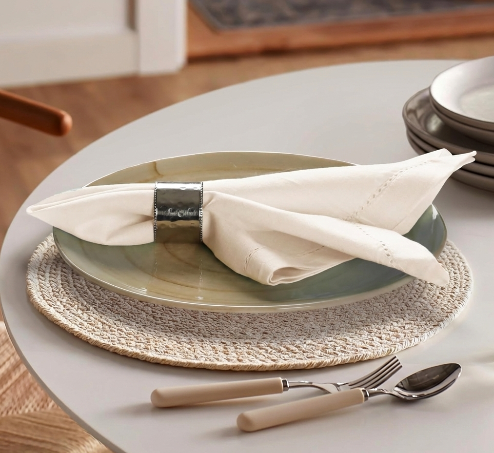 Best home decor gift idea – elegant dining table setup with ceramic plate, cloth napkin, and stylish napkin ring.